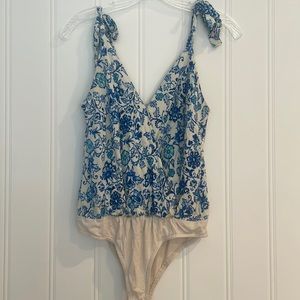 Size small blue and white body suit.